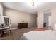 Neutral primary bedroom with a soft carpet, large closet, and an en-suite bathroom at 30876 W Verde Ln, Buckeye, AZ 85396