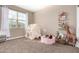 bedroom features a window and toys at 30876 W Verde Ln, Buckeye, AZ 85396