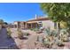 Expansive backyard featuring desert landscaping, a covered patio and block fencing at 309 E Mountain Sky Ave, Phoenix, AZ 85048