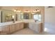 Bright bathroom featuring a double vanity with spacious countertop and large mirror at 309 E Mountain Sky Ave, Phoenix, AZ 85048