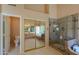 Modern bathroom featuring glass shower and separate tub next to mirrored closet at 309 E Mountain Sky Ave, Phoenix, AZ 85048