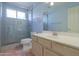 Bright bathroom with glass shower, tile flooring, and a vanity at 309 E Mountain Sky Ave, Phoenix, AZ 85048