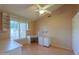 Bedroom with desk, built-in shelving, and a ceiling fan at 309 E Mountain Sky Ave, Phoenix, AZ 85048