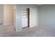 Carpeted bedroom featuring closet with built-in storage drawers at 309 E Mountain Sky Ave, Phoenix, AZ 85048