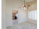 Open-concept dining area features neutral tones, tile flooring, and seamless access to the kitchen at 309 E Mountain Sky Ave, Phoenix, AZ 85048