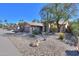 Charming single-story home features desert landscaping, mature trees, and a tile roof on a sunny day at 309 E Mountain Sky Ave, Phoenix, AZ 85048