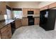 Bright kitchen featuring granite counters, stainless steel appliances, and tile flooring at 309 E Mountain Sky Ave, Phoenix, AZ 85048