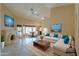 Living room with fireplace, kitchen nook, and sectional sofa staged with decorative throw pillows at 309 E Mountain Sky Ave, Phoenix, AZ 85048