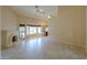 Neutral living room with a tiled floor, fireplace, high ceilings, and a kitchen nook at 309 E Mountain Sky Ave, Phoenix, AZ 85048