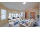 Bright living room showcases a skylight, tile flooring, and ample seating and natural light at 309 E Mountain Sky Ave, Phoenix, AZ 85048