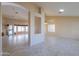 Bright and airy living room boasts tile floors and flows into the adjacent spaces, creating a cohesive layout at 309 E Mountain Sky Ave, Phoenix, AZ 85048