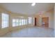 Spacious living room with tile flooring, large windows, and a skylight, offering abundant natural light at 309 E Mountain Sky Ave, Phoenix, AZ 85048