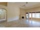 Open concept living room with tiled flooring, fireplace, and view to the kitchen nook at 309 E Mountain Sky Ave, Phoenix, AZ 85048