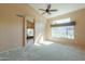 Empty main bedroom with ensuite bathroom and views of the landscaped backyard at 309 E Mountain Sky Ave, Phoenix, AZ 85048