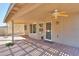 Back patio with neutral walls and partially covered patio area at 309 E Mountain Sky Ave, Phoenix, AZ 85048