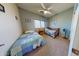 Bedroom with twin beds, blue walls, carpet, and a window with blinds at 33732 N Sandstone Dr, San Tan Valley, AZ 85143