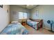 Bedroom with twin beds, blue walls, carpet, and a window with blinds at 33732 N Sandstone Dr, San Tan Valley, AZ 85143