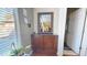 Inviting entryway featuring a wooden cabinet and a decorative mirror at 33732 N Sandstone Dr, San Tan Valley, AZ 85143