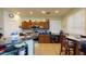 Well-equipped kitchen featuring stainless steel appliances, tile backsplash, and counter seating at 33732 N Sandstone Dr, San Tan Valley, AZ 85143