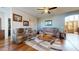 Cozy living room with comfortable seating, a stylish rug, and hardwood floors at 33732 N Sandstone Dr, San Tan Valley, AZ 85143