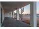 Spacious covered back patio with stamped concrete flooring, columns and a spiral staircase at 37931 N 31St Ave, Phoenix, AZ 85086