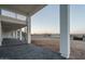 Spacious covered back patio with stamped concrete flooring and a spiral staircase at 37931 N 31St Ave, Phoenix, AZ 85086