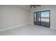 Bedroom features tile floor, slider to the backyard, and ceiling fan at 37931 N 31St Ave, Phoenix, AZ 85086