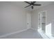 Bright bedroom featuring neutral paint, a ceiling fan, and a walk-in closet at 37931 N 31St Ave, Phoenix, AZ 85086