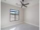 Bright bedroom featuring large windows with desert views and modern tile flooring in a newly built home at 37931 N 31St Ave, Phoenix, AZ 85086