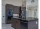 Kitchen island featuring sink and stainless steel dishwasher at 37931 N 31St Ave, Phoenix, AZ 85086