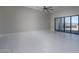 Spacious living area with tile flooring, floor to ceiling slider door, and mountain views at 37931 N 31St Ave, Phoenix, AZ 85086