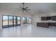 Bright and airy living room featuring tile flooring, large windows, and an open layout with modern lighting at 37931 N 31St Ave, Phoenix, AZ 85086