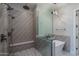 Modern bathroom featuring a walk-in shower with dual shower heads, a soaking tub and unique tile design at 37931 N 31St Ave, Phoenix, AZ 85086