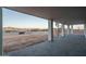 Covered back patio with brick pavers and a spiral staircase leading to upper level at 37937 N 31St Ave, Phoenix, AZ 85086