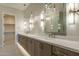 Bathroom featuring double vanity and mirrors, and walk-in closet at 37937 N 31St Ave, Phoenix, AZ 85086