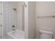 Cozy bathroom featuring a white bathtub with a tiled backsplash and modern fixtures at 37937 N 31St Ave, Phoenix, AZ 85086