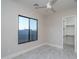 Bright bedroom featuring a large window and access to a closet, providing comfort and convenience at 37937 N 31St Ave, Phoenix, AZ 85086