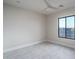 Bright and neutral bedroom space with a large window offering ample natural light at 37937 N 31St Ave, Phoenix, AZ 85086