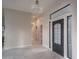 Bright entryway featuring tile floors, high ceilings, and a black front door with sidelights at 37937 N 31St Ave, Phoenix, AZ 85086