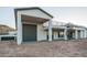 Modern home exterior with a garage, second story patio, spiral staircase and desert landscaping at 37937 N 31St Ave, Phoenix, AZ 85086