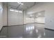 Wide-angle view of garage with large doors and multiple parking spaces at 37937 N 31St Ave, Phoenix, AZ 85086