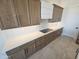 Modern kitchen counter with white subway tile backsplash and sleek appliances at 37937 N 31St Ave, Phoenix, AZ 85086