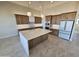 Spacious kitchen with a central island, modern appliances, and ample cabinet space at 37937 N 31St Ave, Phoenix, AZ 85086