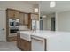 Well-lit kitchen featuring stainless steel appliances and a farmhouse sink at 37937 N 31St Ave, Phoenix, AZ 85086