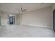 Bright open-concept living room featuring tile flooring and stylish ceiling fan at 37937 N 31St Ave, Phoenix, AZ 85086