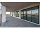 Modern patio with an expansive set of sliding glass doors and views of the mountains beyond at 37937 N 31St Ave, Phoenix, AZ 85086