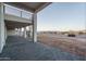 Open patio with decorative brickwork, spiral staircase, and expansive view of the desert landscape at 37937 N 31St Ave, Phoenix, AZ 85086