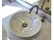 Close-up of a decorative sink with chrome faucet atop a white marble countertop at 37937 N 31St Ave, Phoenix, AZ 85086