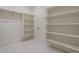 Well-organized walk-in closet with shelving and a hanging rod, providing efficient storage solutions at 37937 N 31St Ave, Phoenix, AZ 85086