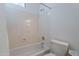 Bathroom featuring a combination shower and bathtub with white walls and a toilet at 4266 E Cassia Ln, Gilbert, AZ 85298